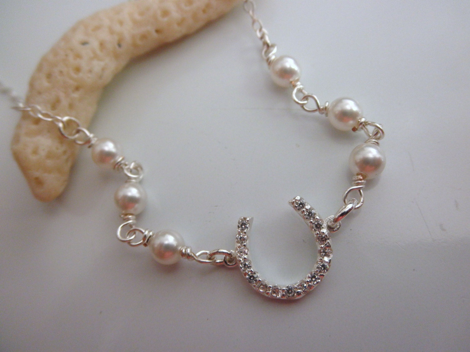 CZ sterling silver horseshoe bracelet with swarovski pearls
