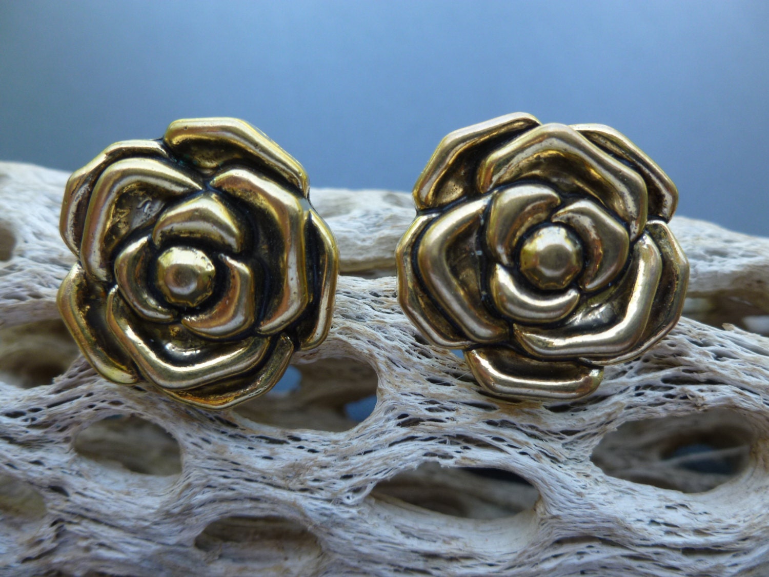 Large Gold flower clip earrings.