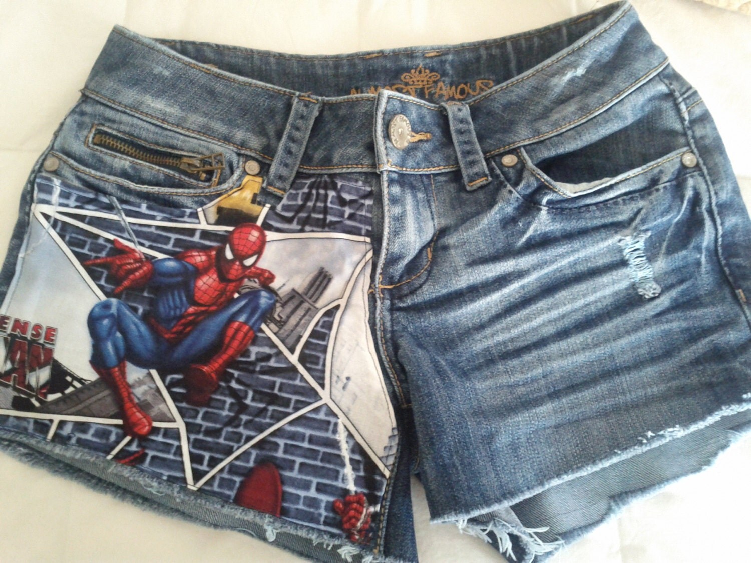 Custom. Denim shorts with Marvel Spider-Man fabric on one