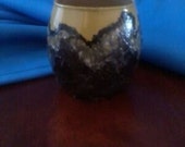 Small beige and black votive or tea candle holder