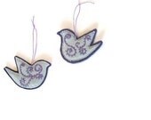 Bird pair ornaments/embroidered aqua velvet on purple felt