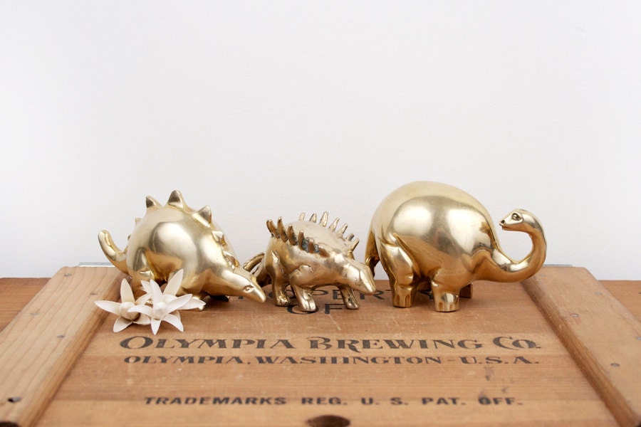 brass dinosaur figurine