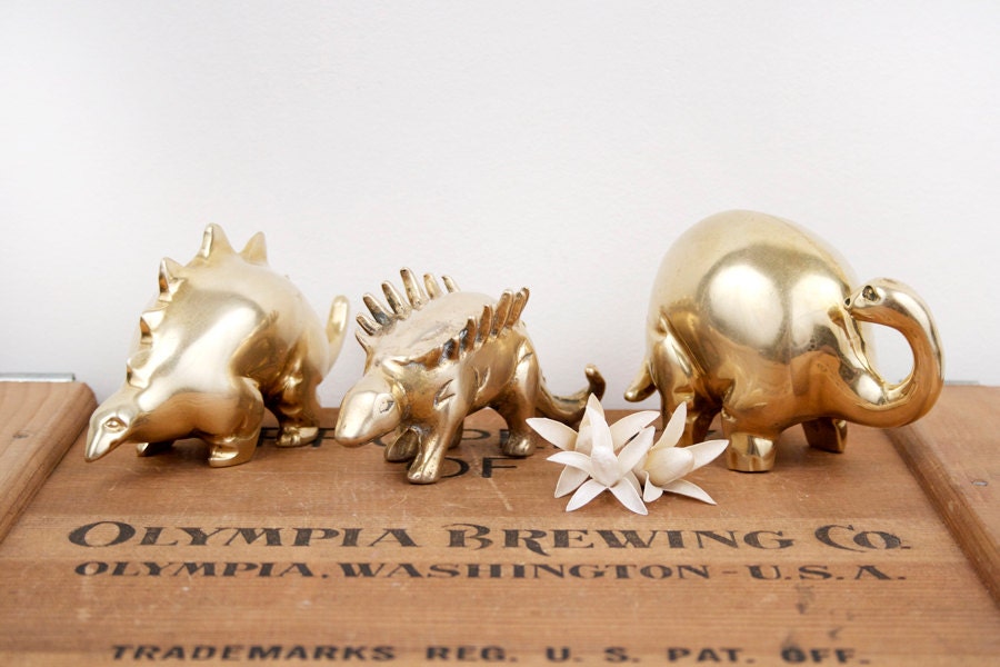 brass dinosaur figurine