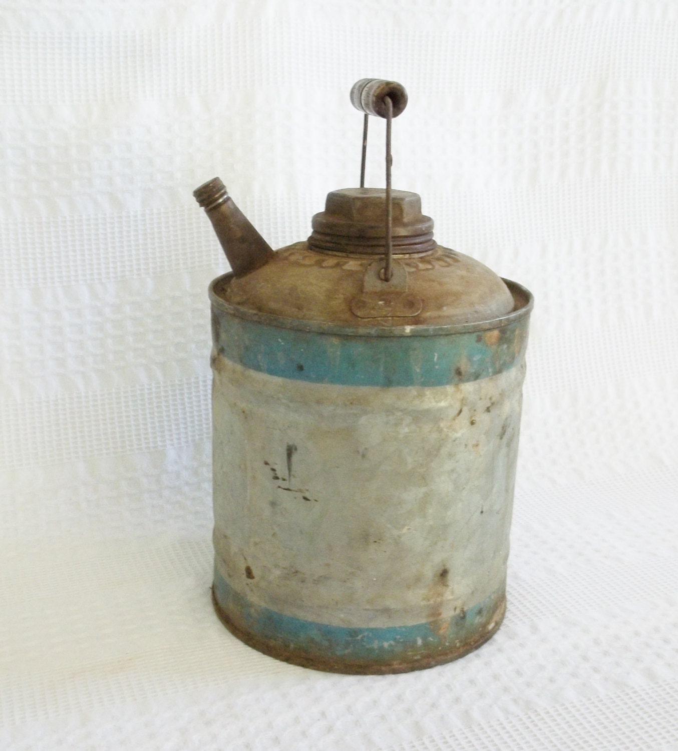 Vintage gas oil kerosene can with teal band stripe.