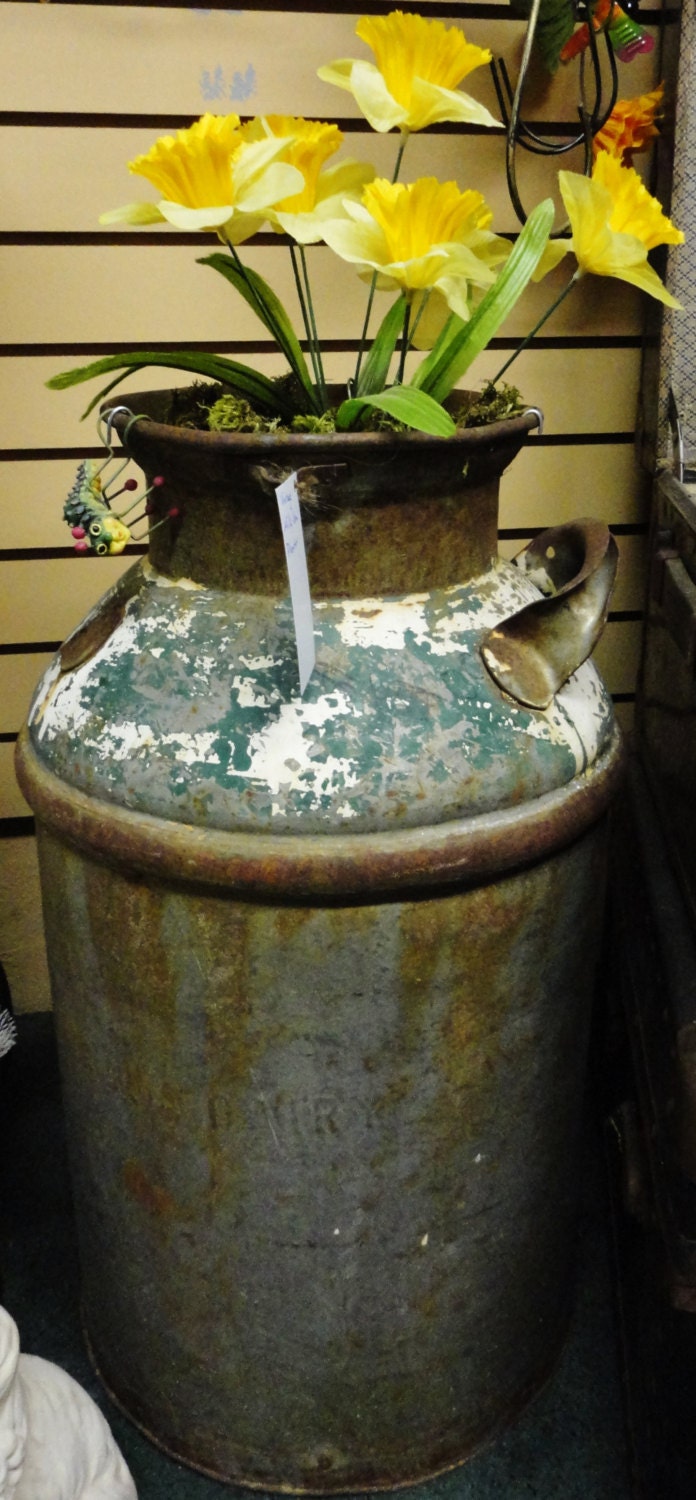 Items in search results We have taken some of our more rustic used, abused and forgotten milk cans and repurposed them for great outdoor use! This cute milk can planter comes with a black plastic 8