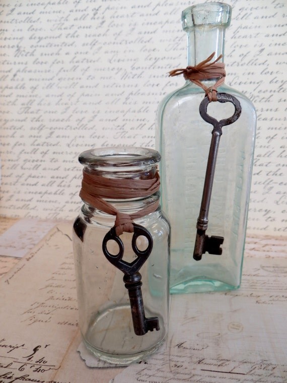 Two Antique Vintage Glass Bottles with Skeleton Keys