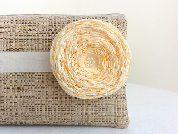 tan woven clutch