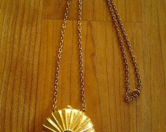 1970s Estee Lauder solid perfume pendant