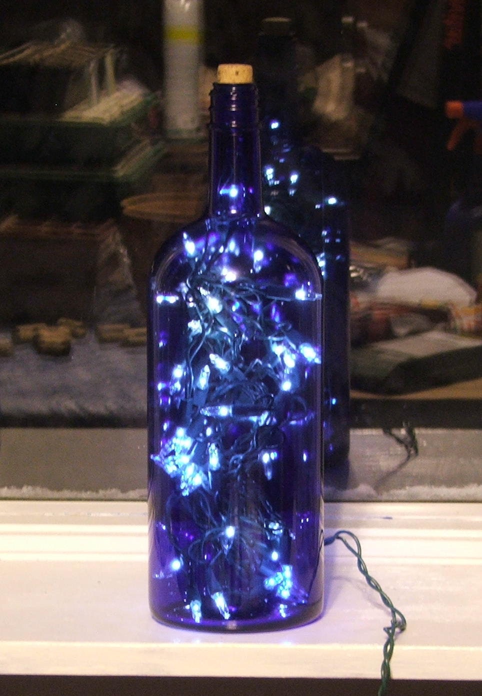 Large Blue Glass Bottle Light with white lights inside