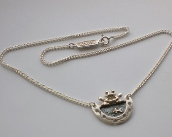 Looking after the little ones,silver frog and tadpole necklace