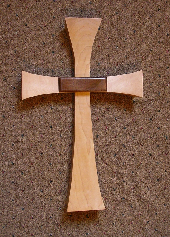 Maple wooden cross with walnut embellishment. Arms gently
