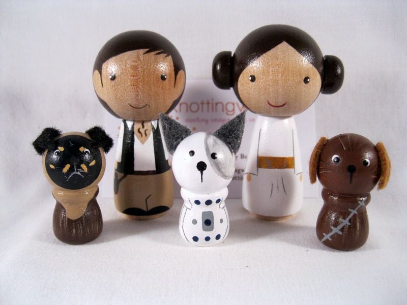 Our customer cake toppers from Knotting Wood helped us create a unique way of including our dogs in our wedding without them being there!