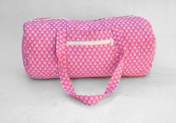 Quilted Duffle bag in Pink with White floral print.