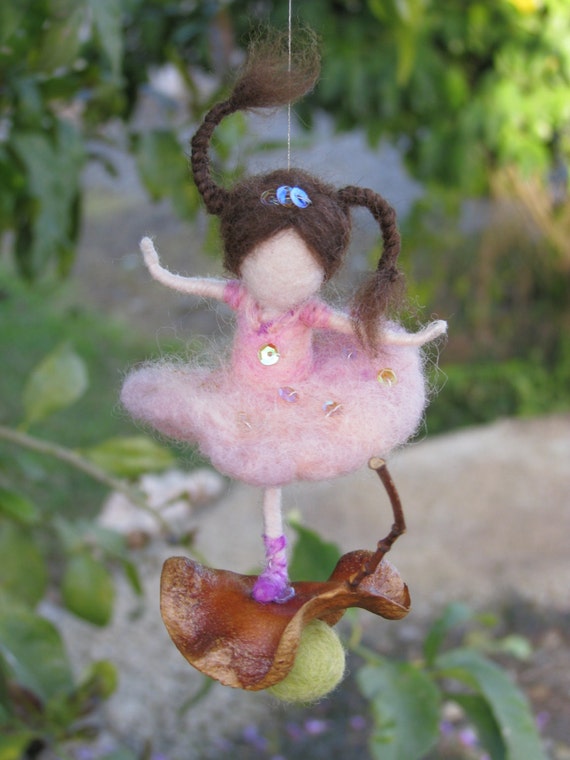 Waldorf inspired needle felted ballerina dancing on a seed