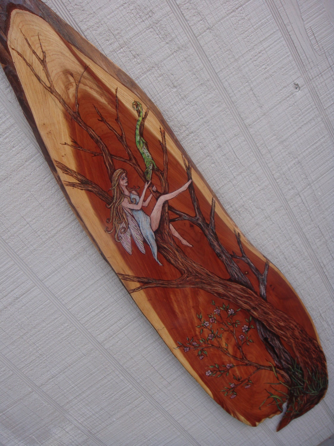 wood burning pyrography on cedar plank Fairy and lizard
