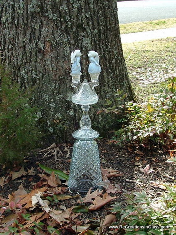 Garden art.  "Anticipation" is whimsical assembled glass sculpture made with repurposed glass.