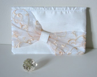 white bow clutch bag