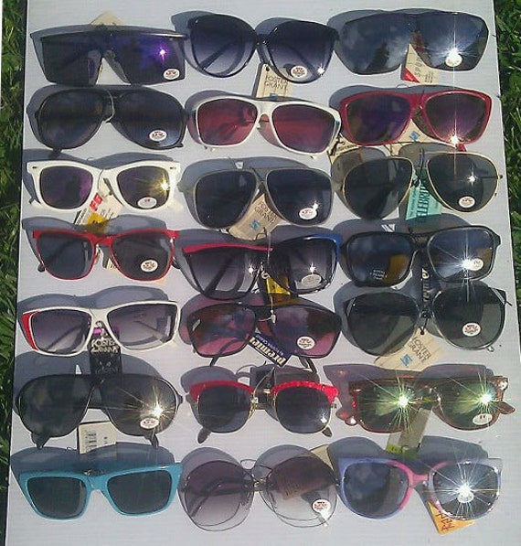 63 Vintage name brand sunglasses 70s and 80s era all in new