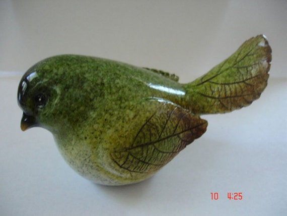 green bird figurine