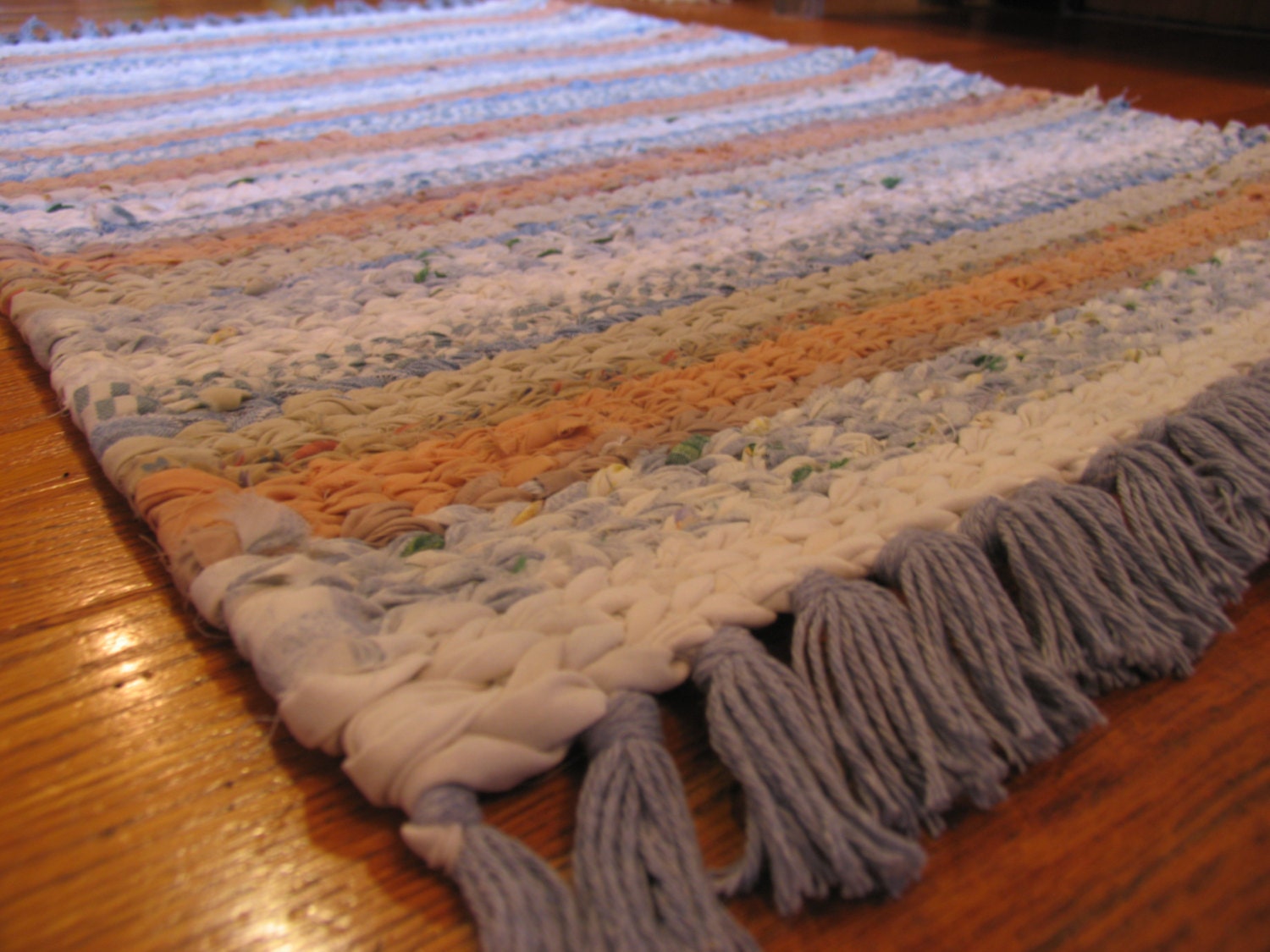 Hand Twined Rag Rug in blues tans and whites with Hand Tied