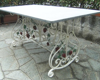 Wrought iron table rectangle scrolls and grape bunches of decorum.