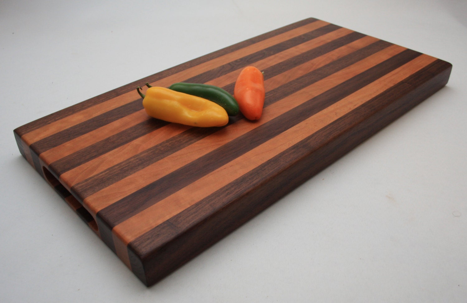 Walnut and Cherry cutting board with handles by