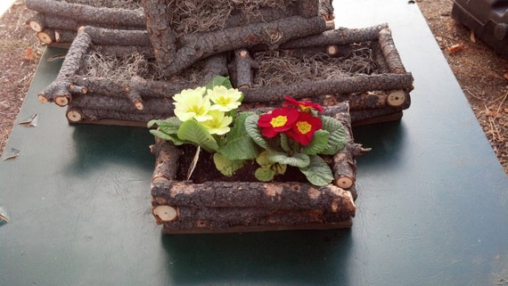 Rustic wood planter boxes. Do not come planted just giving