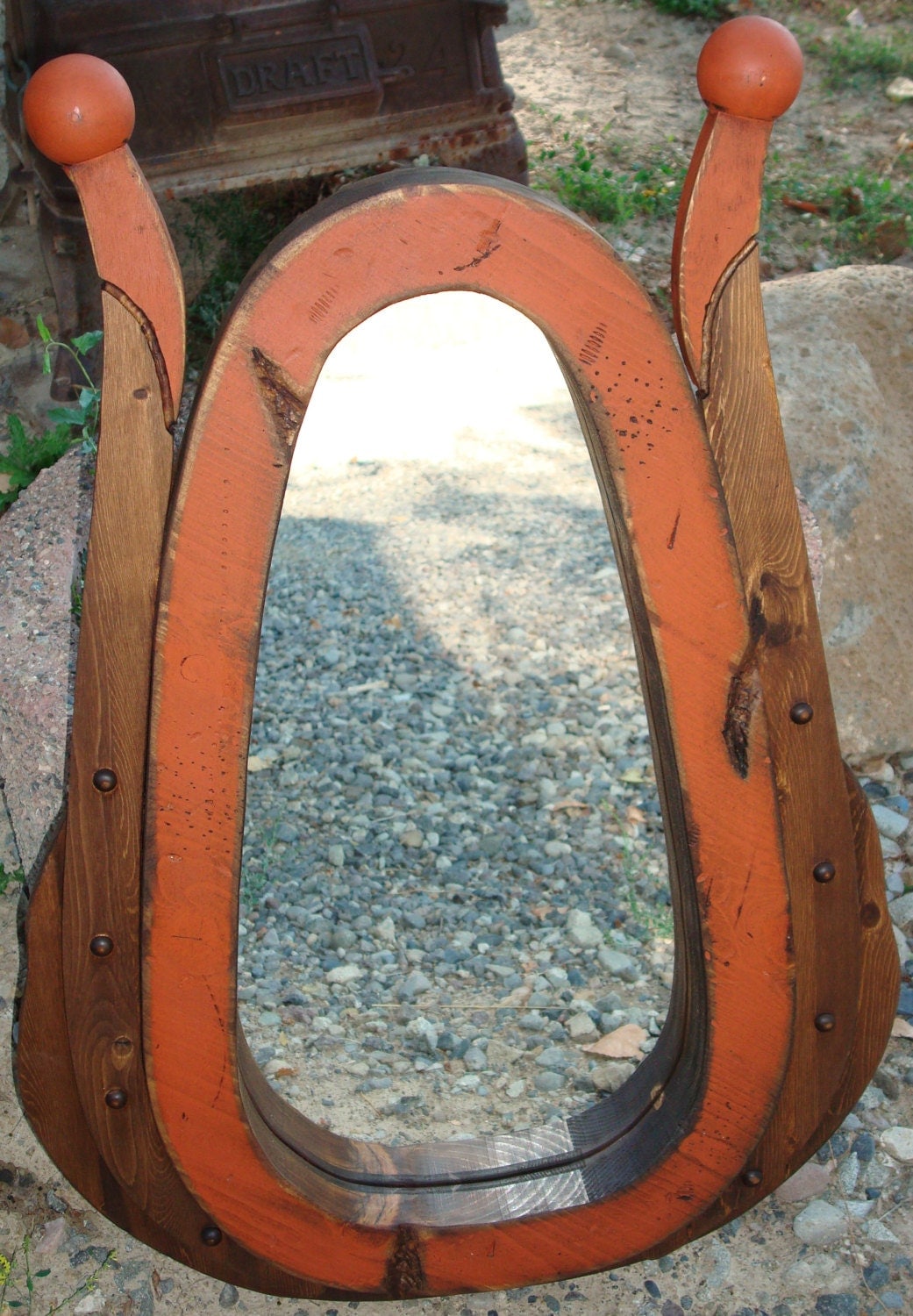 Antiqued wood horse collar mirror.Great wall decor for your