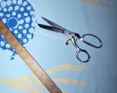 Fabric by the Yard  light blue hand printed, silk screened yardage in metallic gold feather rings and blue firework remnants