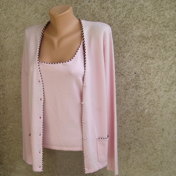 Cardigan sweater set pink background online catalogs