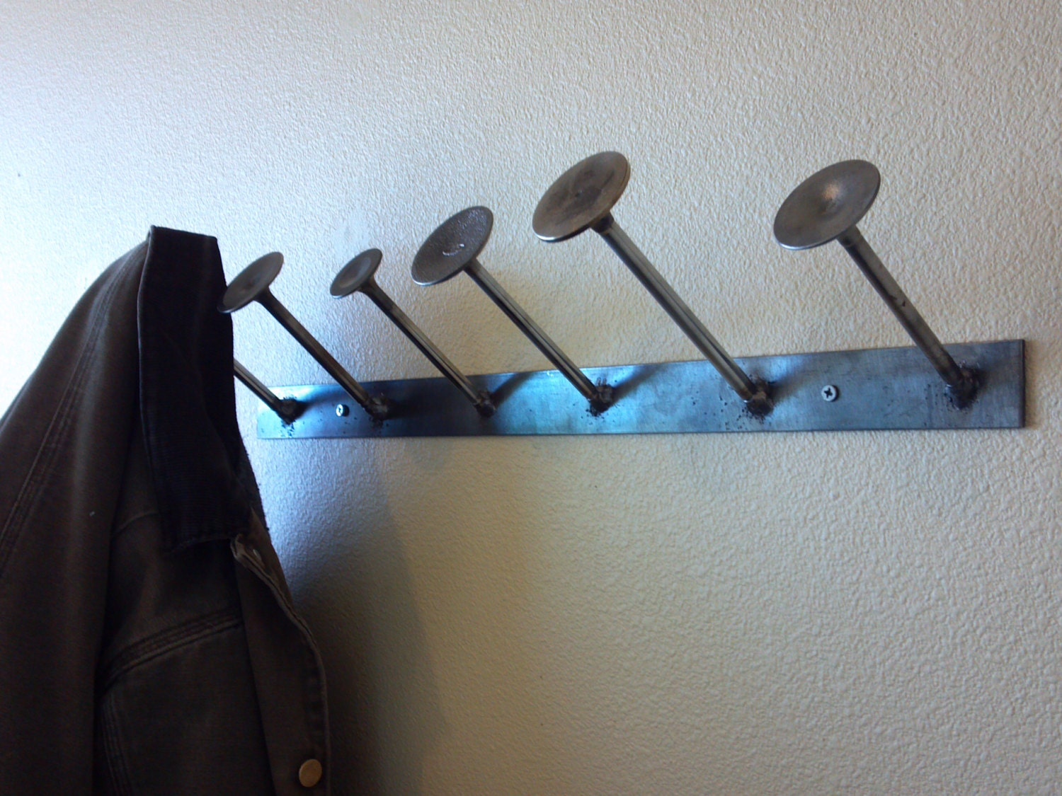 Wall mounted welded coat rack featuring used by ZandersMetalWorks