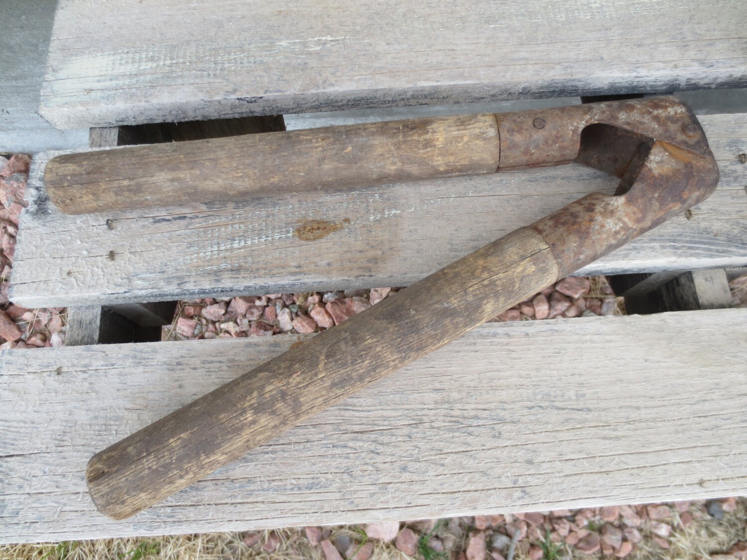 Livestock dehorning primitive ranch tool with wood handles