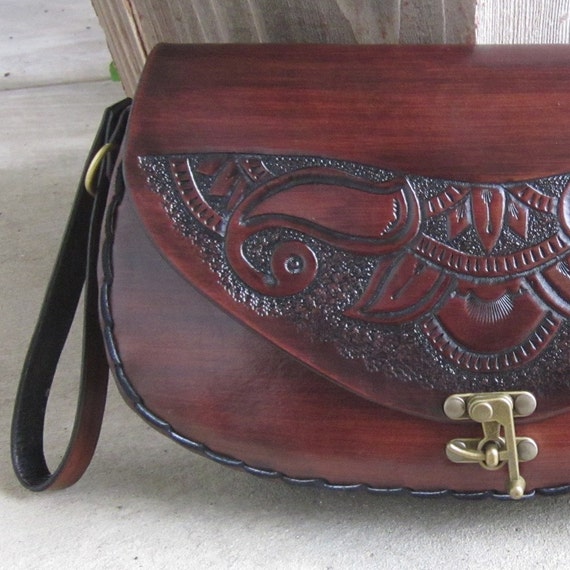 The Theda....Handmade Tooled Leather Clutch by ContrivedtoCharm