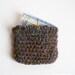 small crochet wallet/card pouch with floral/butterfly lining.