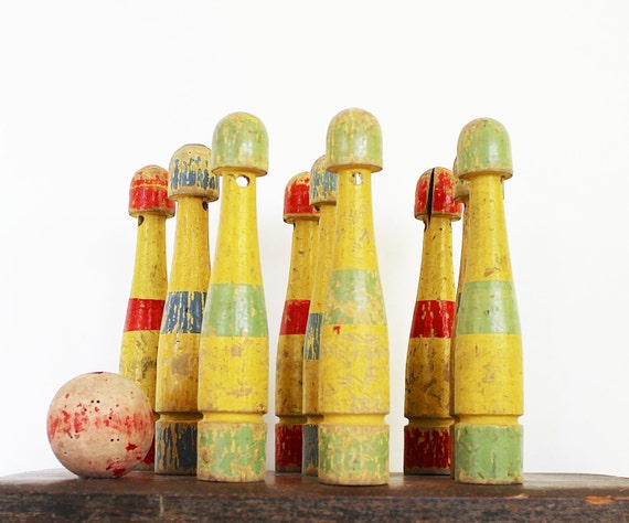 antique skittles game with wooden pins and iron bumbers