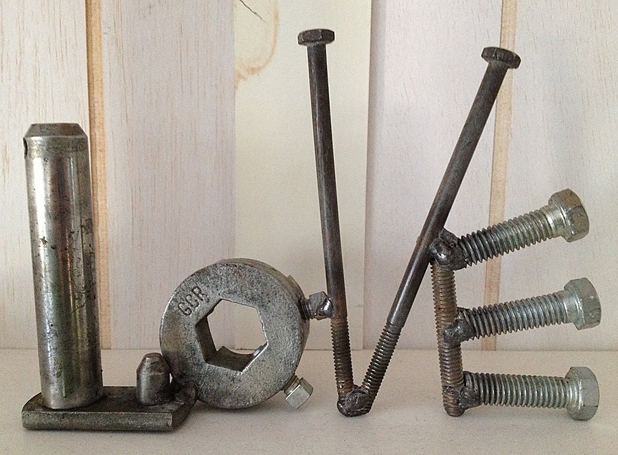 Love metal word art from found objects