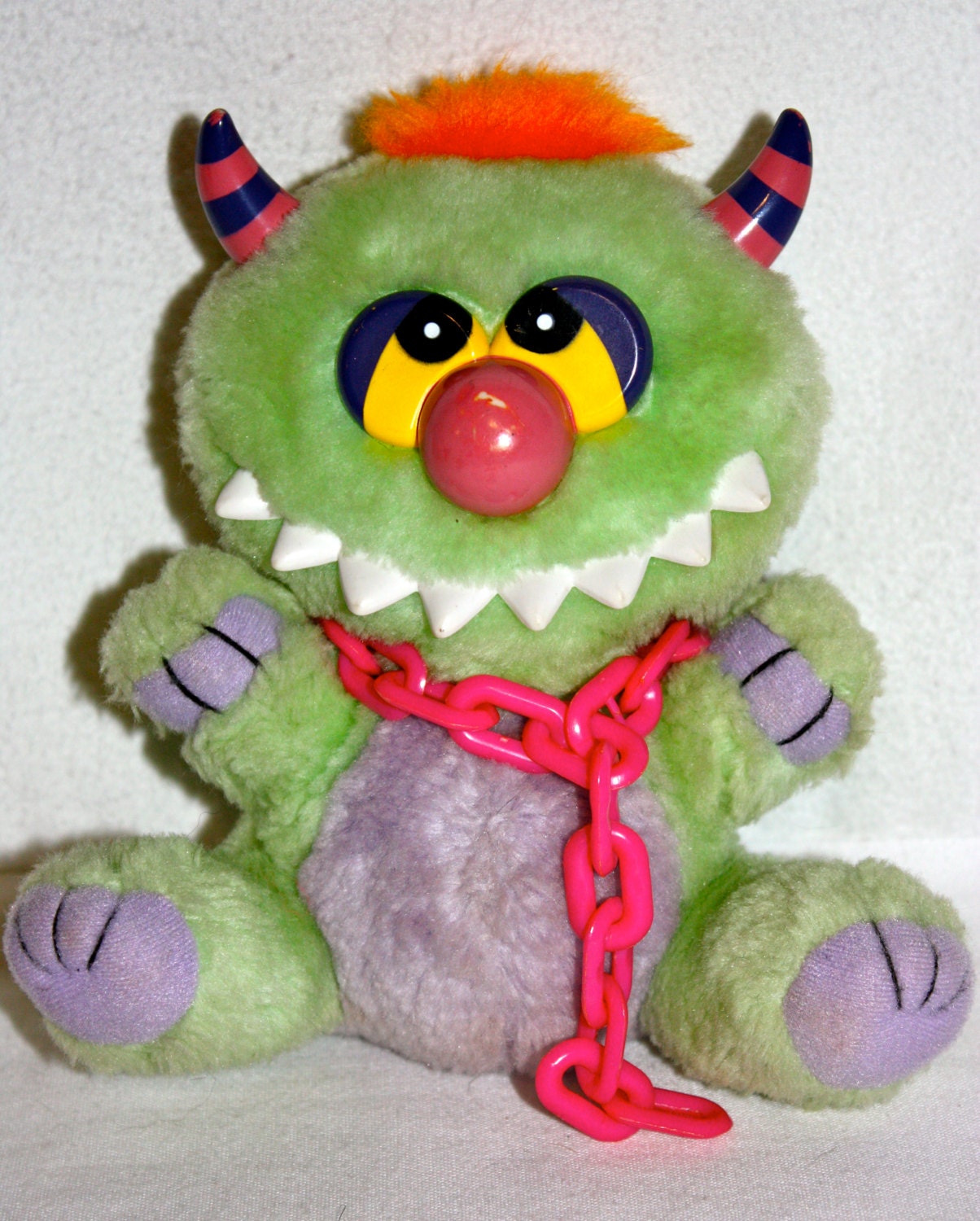 80s toy monster with handcuffs