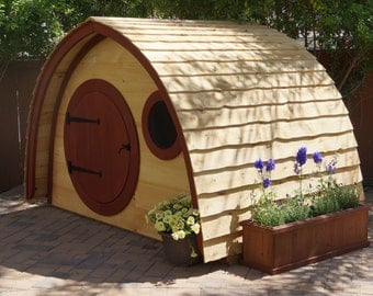 Hobbit Hole Playhouse Kit: outdoor wooden kids playhouse with round front door and windows, made to order