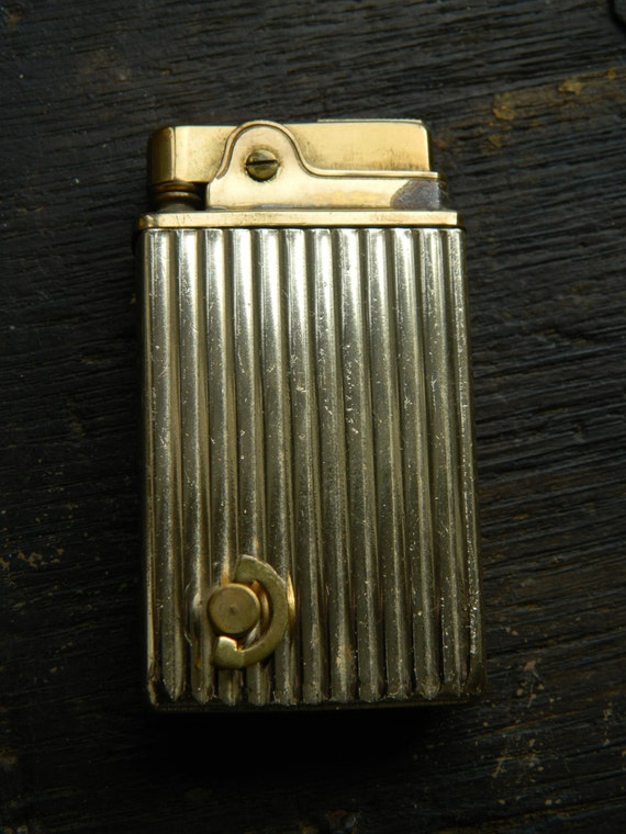 A Vintage Crown Musical Cigarette Lighter