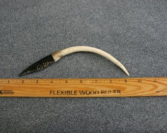 Flintknapped obsidian knife with scrimshaw of a bald eagle on an antler handle.