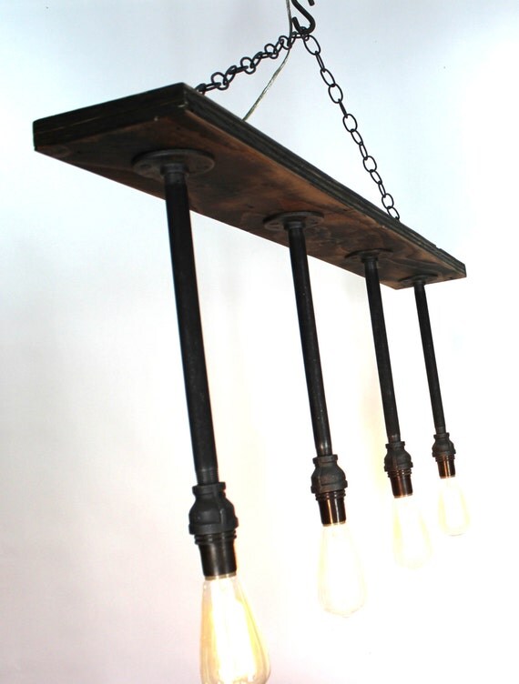 Items similar to hand crafted hanging black pipe 4 light fixture on Etsy