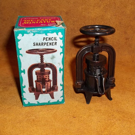 Vintage Fruit Press Die Cast Miniature Pencil Sharpener with