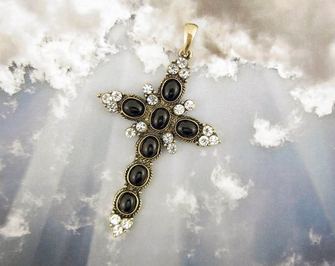 Black Acrylic Oval Cabochon Decorated Gold-tone Cross Rhinestone Accents