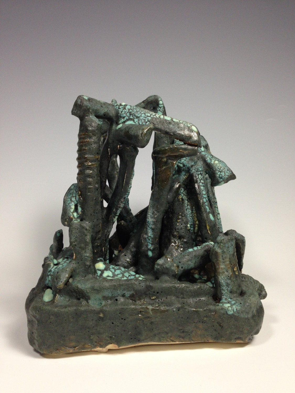 Original clay sculpture geometric greens blacks