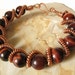 Copper coiled wire spiral red tiger eye bracelet on Etsy