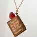 Hemingway Book Locket Necklace..Hand engraved Hemingway quote on the back of a vintage brass book-shaped locket