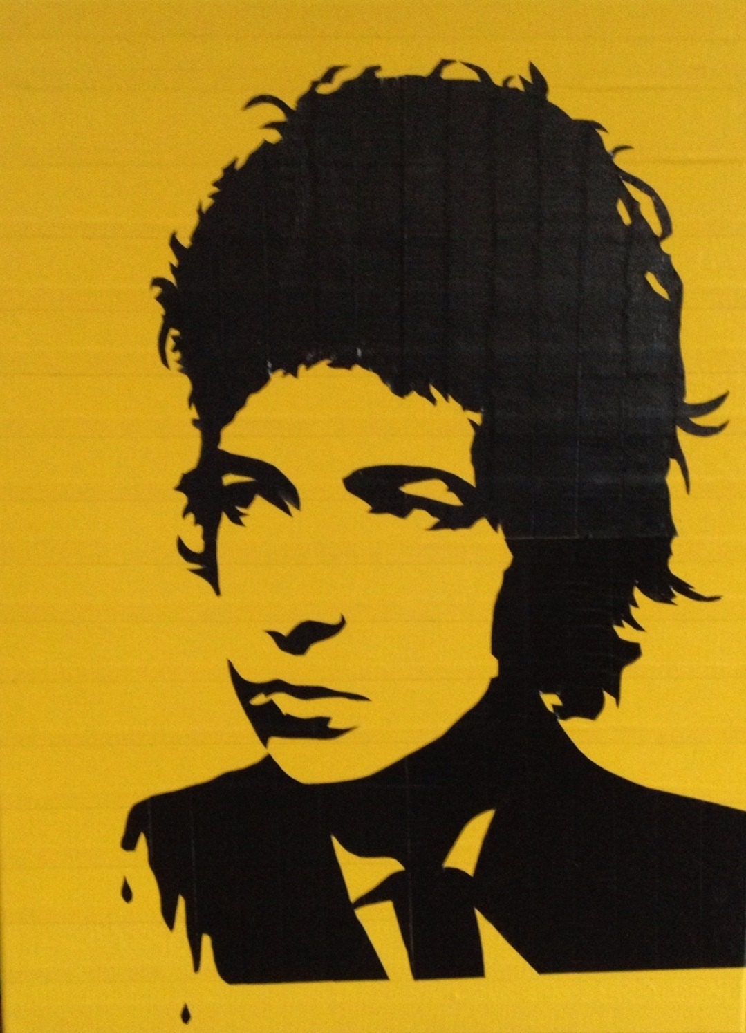 Yellow 18x24 duct taped street art stencil of bob dylan on