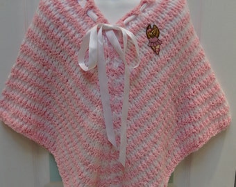 HAND KNITTED PONCHO: childs, pink and white striped, made of cuddle spun yarn, for the 5 to 6 year old,with a Ballerina applique