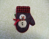 Needle Felted Snowman On A Charcoal Colored Wool Felt Mitten Pin