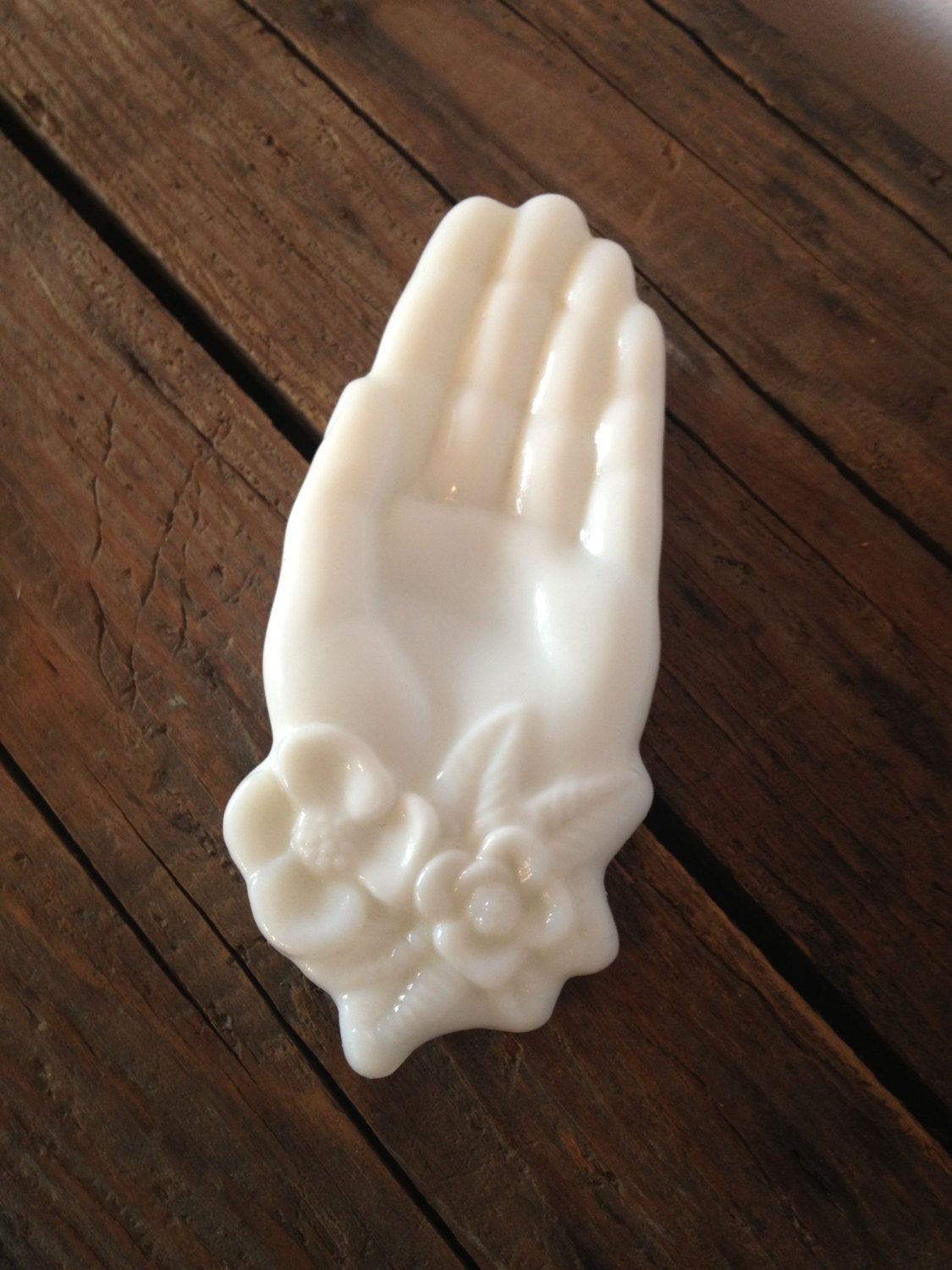 Vintage white milk glass giving hand with flower corsage